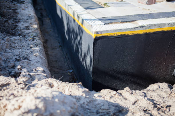 Professional Basement Waterproofing technician working in Montrose, MN